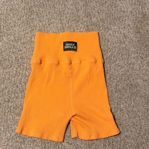 daily drills orange biker shorts